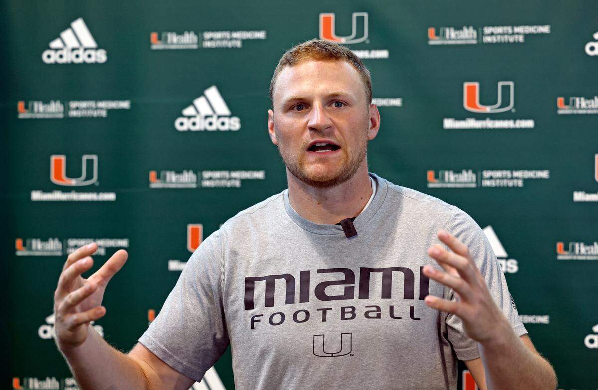 Miami Hurricanes quarterback Tyler Van Dyke (9) speaks with reporters after practice at the Carol Soffer Indoor Practice Facility at the University of Miami in Coral Gables on Wednesday, August 9, 2023.