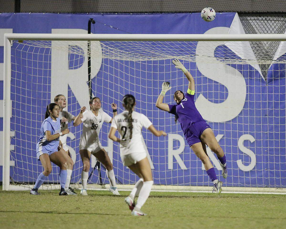 Pembroke Pines Charter goalkeeper Madison Casanova (1) makes a save during the Region 4-5A final girls soccer match against Lourdes Academy on Tuesday, February 17, 2026 at Miami-Dade College Kendal campus. Andrew Uloza / for Miami Herald