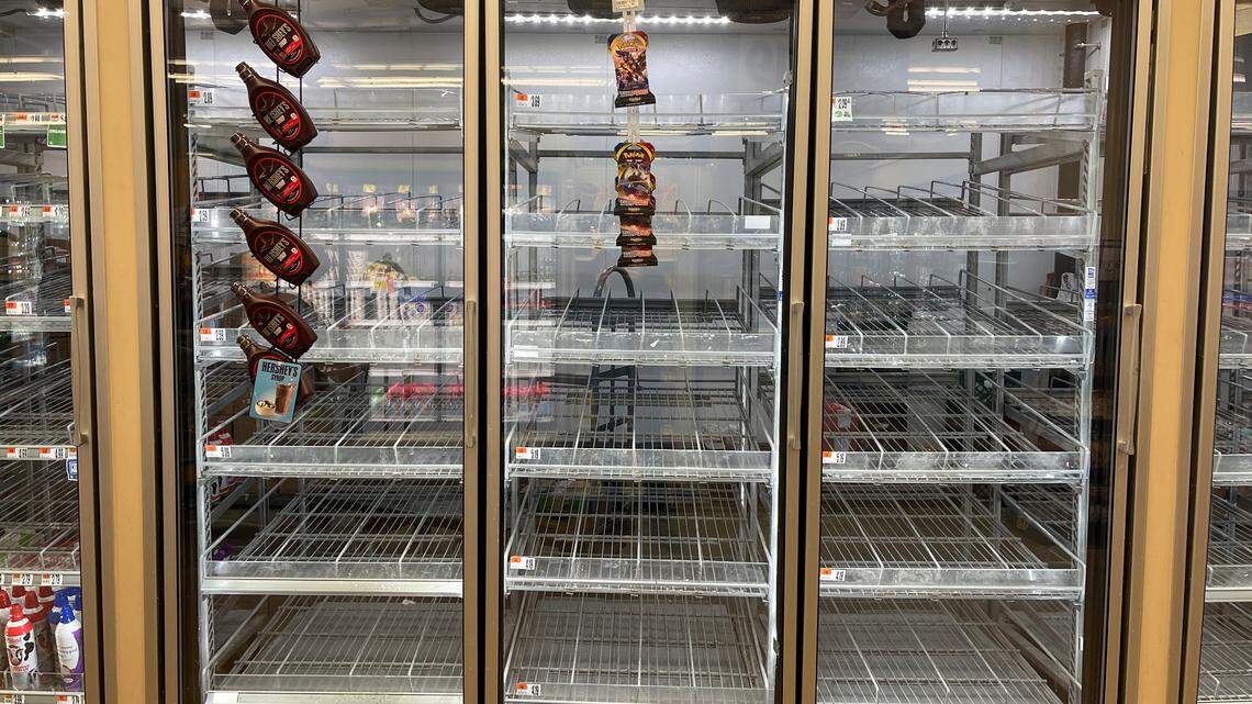The milk shelf is mostly empty at a Giant grocery store on Tuesday, Jan. 11, 2022, in Washington, D.C. Grocery stores have experienced increased shortages recently due to a number of factors, including the omicron variant.