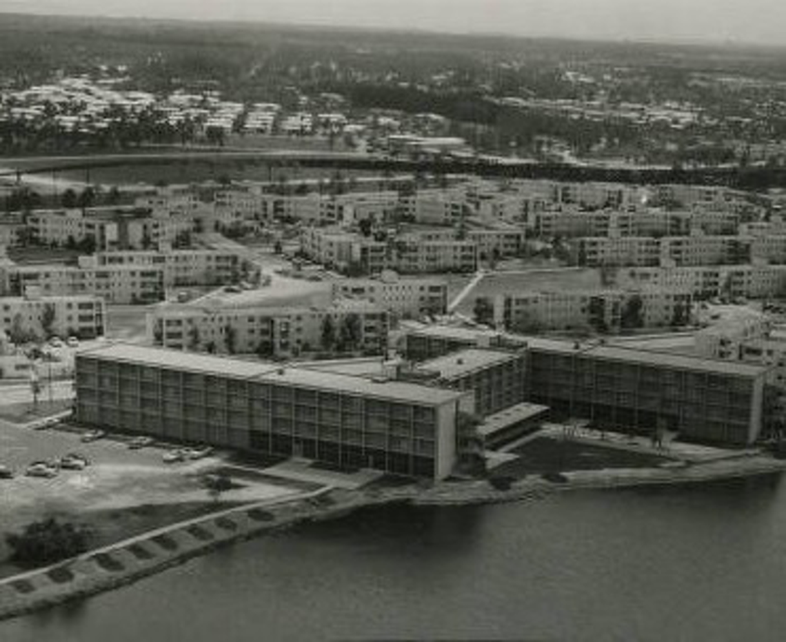 Eaton Hall, the H-shaped dormitory building completed in 1954 on the edge of Lake Osceola on the University of Miami’s Coral Gables campus, is seen at bottom in an undated photograph. In the background are the campus’ original dorm buildings, all but a few of which have been demolished.