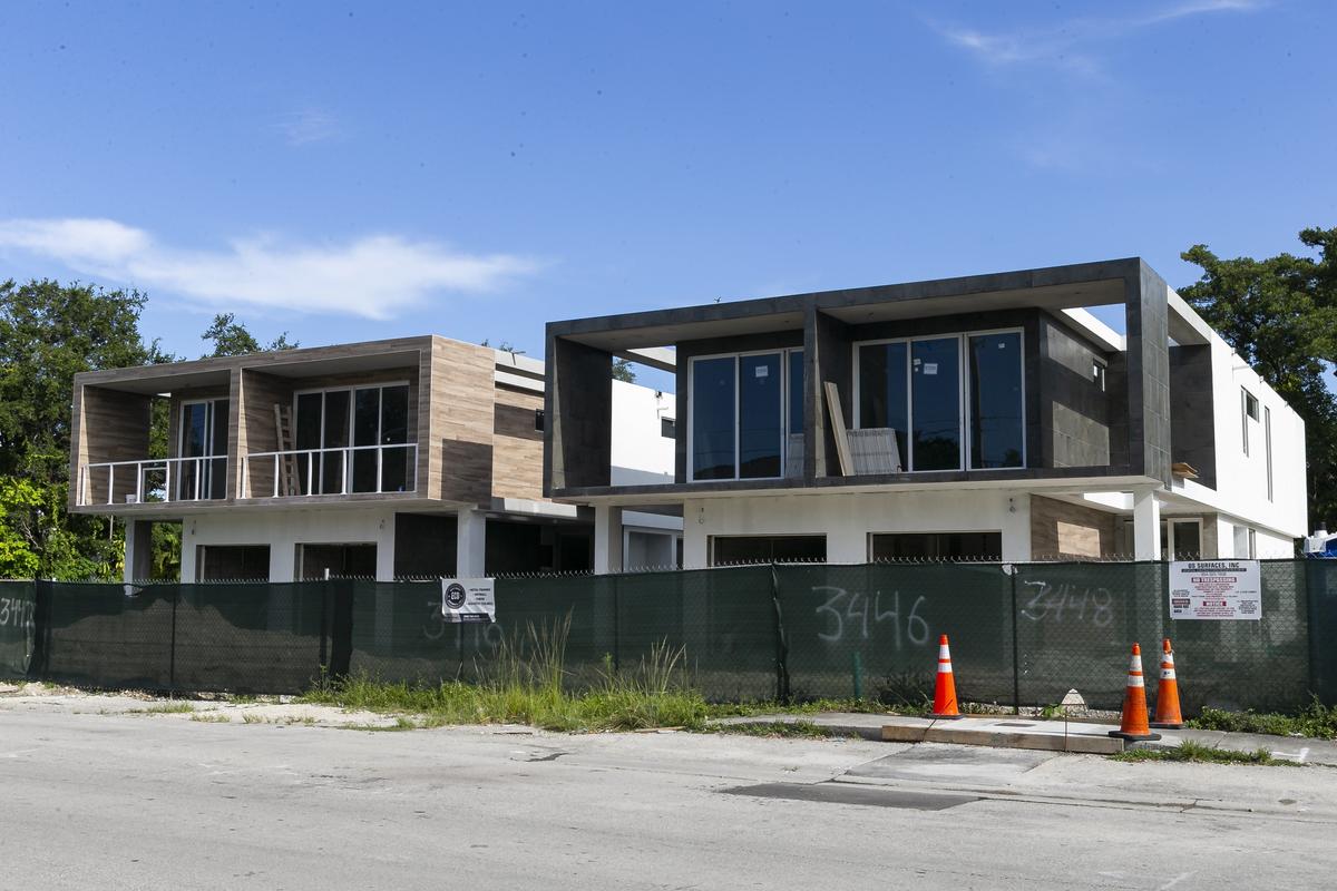 New boxy duplexes in one of Miami’s oldest neighborhoods have replaced the tree-shaded homes that used to stand on the 3400 block of Day Avenue in West Coconut Grove.