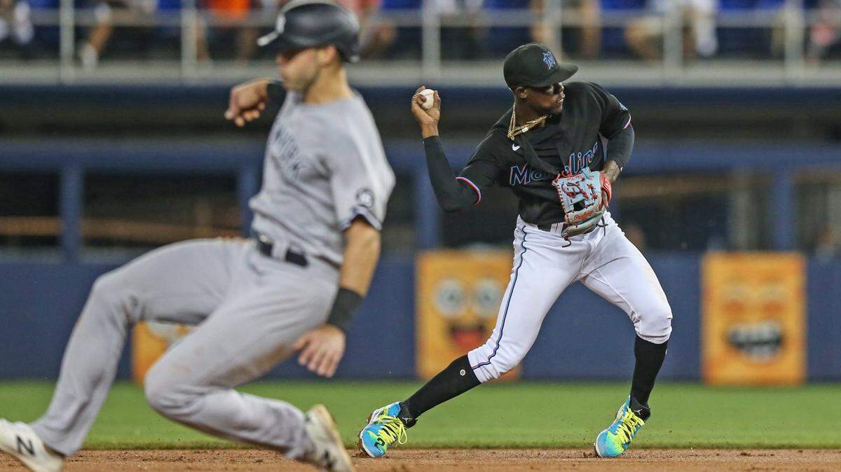 Miami Marlins second baseman Jazz Chisholm Jr. (2) fields the ball and throws to first base to tag out out New York Yankees right fielder Aaron Judge (99) in the third inniing during baseball game at loanDepotpark in Miami on Friday, July 30, 2021.