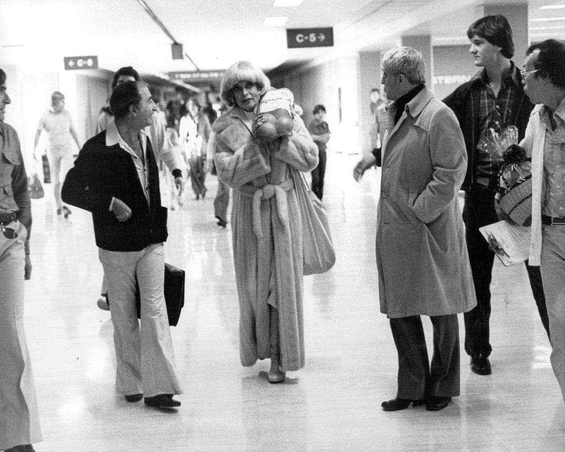 Entertainer Carol Channing meets her entourage at MIA.