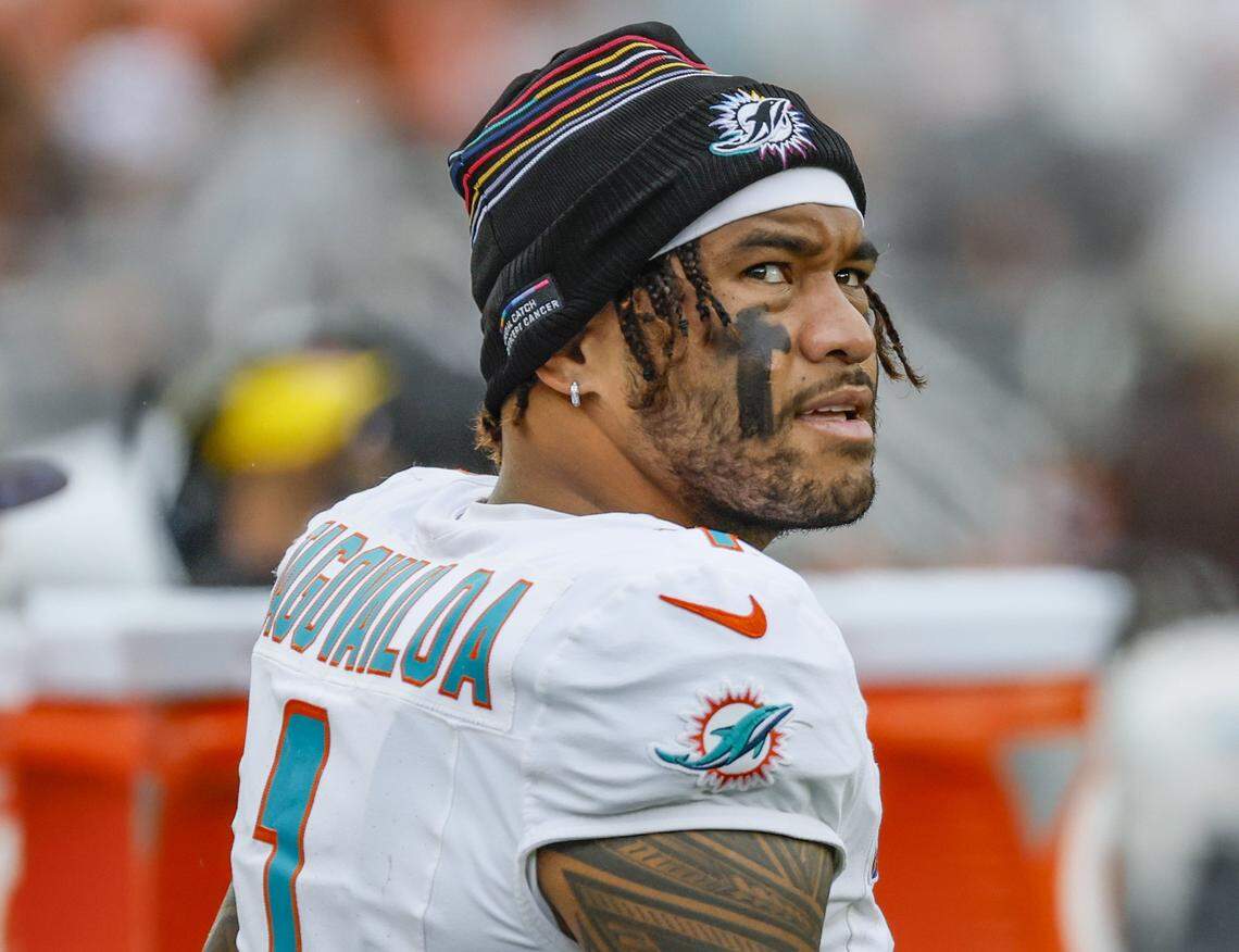 Miami Dolphins quarterback Tua Tagovailoa (1) looks over his shoulder in the second half of an NFL football game against the Cleveland Browns at Huntington Bank Field in Cleveland, Ohio, on Sunday, October 19, 2025.