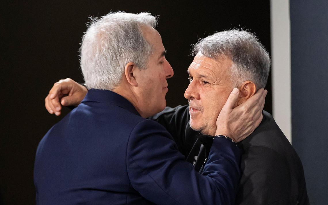 Tata Martino, after announcing that he is stepping down as head coach of Inter Miami, hugs Inter Miami managing owner Jorge Mas during a press conference at Chase Stadium on Friday, Nov. 22, 2024, in Fort Lauderdale, Fla