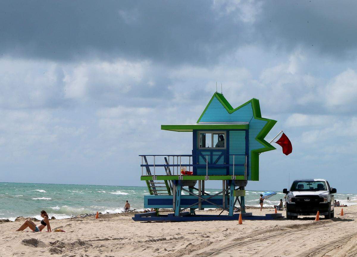 People enjoy a sunny windy day with a red flag (no swimming) advisory in the North Beach area as Hurricane Dorian’s latest track shows the storm has shifted east and north, increasing the possibility that the storm would not make landfall in the state of Florida on Saturday August 31, 2019.