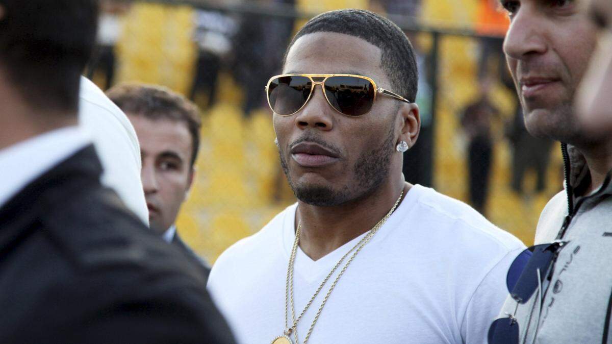 In this March 13, 2015, file photo, rapper Nelly approaches the stage for a concert in Irbil, northern Iraq.