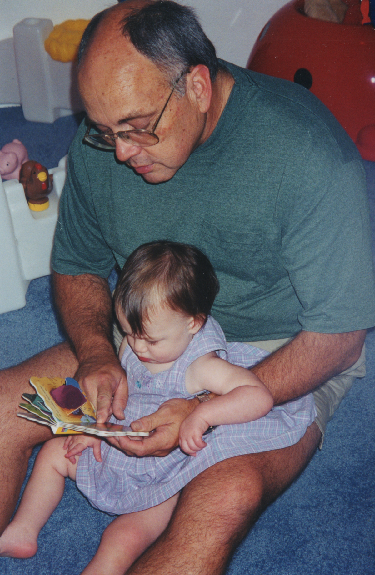 Ransom Everglades teacher Mike Stokes with his granddaughter Sophie Feinberg in a family photo.