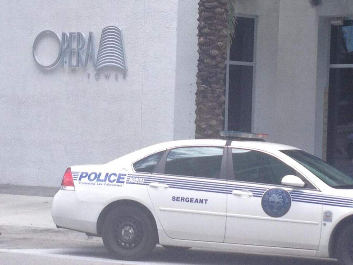 Police investigated a triple-shooting on the 19th floor at the posh Opera Tower in downtown Miami in May 2013.