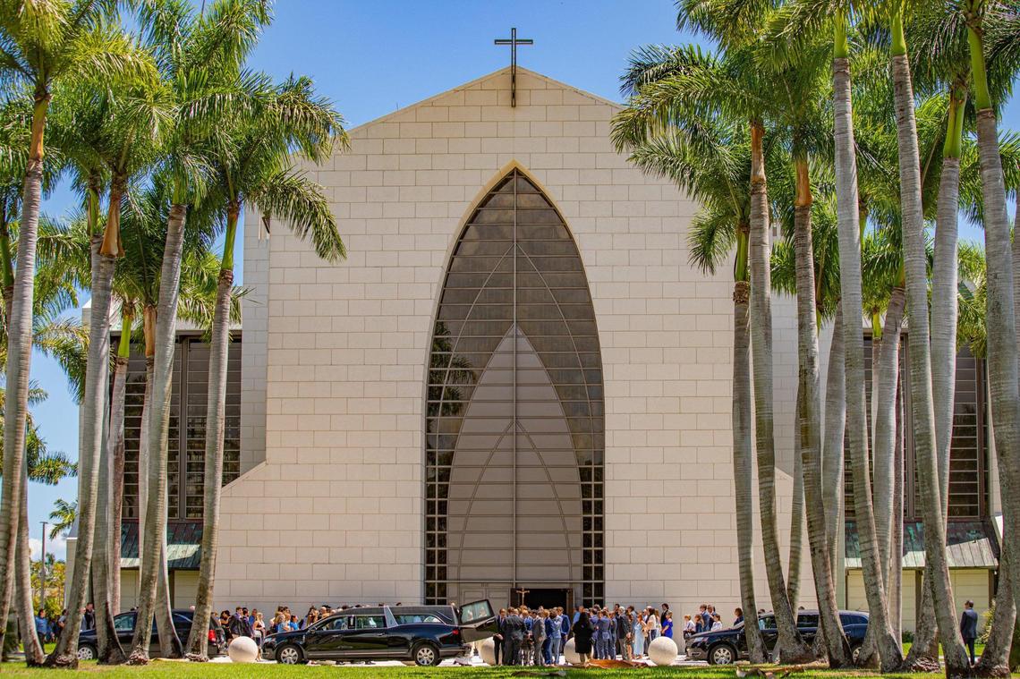 People are seen wearing blue after Lucy Fernandez’s funeral Mass at the Church of the Epiphany in the South Miami area on Monday, Sept. 12, 2022.