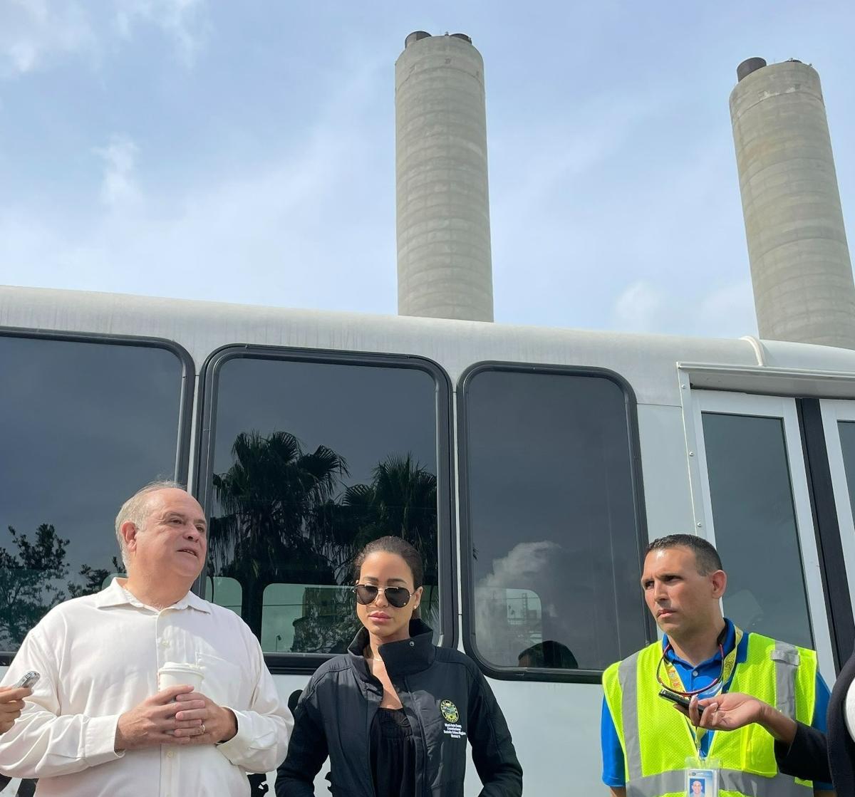 From left to right: Juan Carlos Bermudez and Danielle Cohen Higgins, two Miami-Dade commissioners, and Mike Fernandez, director of the county’s Solid Waste Management Department, gather outside the shuttered Covanta trash incinerator plant on Wednesday, May 31, 2023.