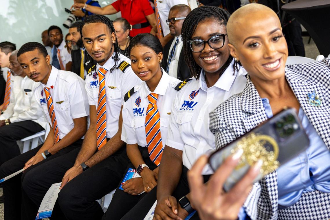 Student pilots take a selfie during an event announcing the scholarship partnership between American Airlines and Florida Memorial University at FMU’s William Lehman Aviation Center.