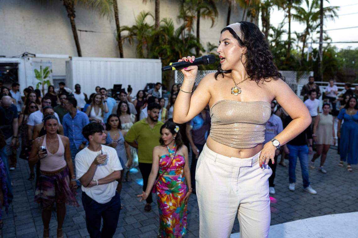 Elisa Baena teaches the basics of salsa to guests during a Salsa Z  event at ZeyZey in Miami.