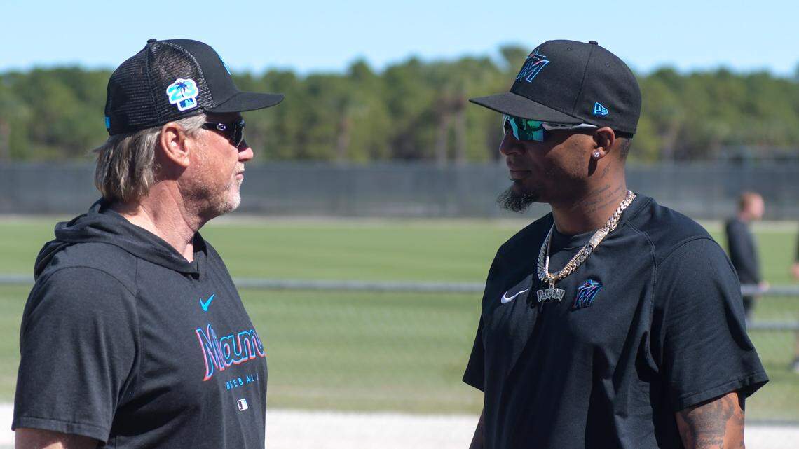 Miami Marlins pitching coach Mel Stottlemyre Jr. talks with pitcher Sixto Sanchez on the back fields of the Roger Dean Chevrolet Stadium complex in Jupiter, Florida, on Monday, Feb. 13, 2023.
