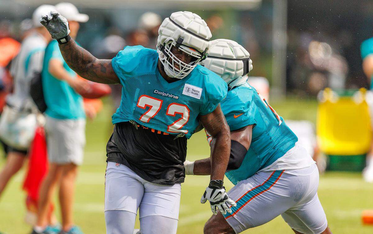 Miami Dolphins offensive tackle Terron Armstead (72) and Miami Dolphins guard Austin Jackson (73) participate in a drill during a joint practice with the Atlanta Falcons at Baptist Health Training Complex in Hard Rock Stadium on Wednesday, August 9, 2023 in Miami Gardens, Florida.