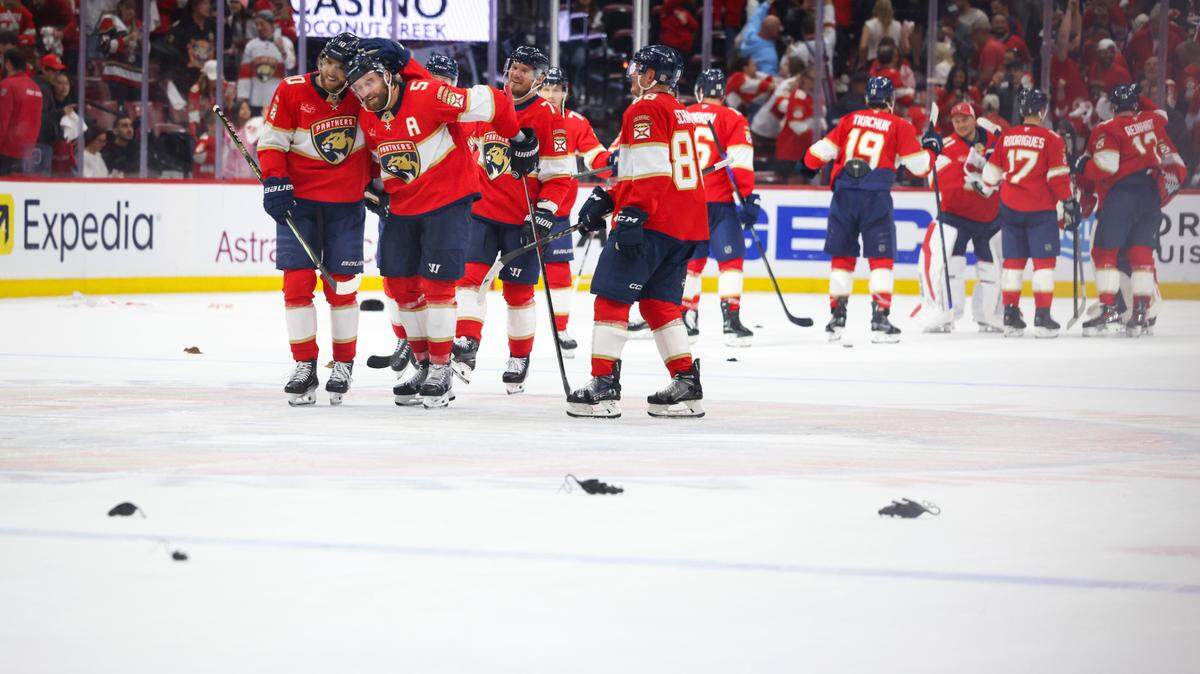 Florida Panthers left wing A.J. Greer (10) hugs defenseman Aaron Ekblad (5) after winning Game 4 of the first-round Stanley Cup playoff series against the Tampa Bay Lightning on Monday, April 28, 2025, at Amerant Bank Arena in Sunrise, Fla. The Panthers won 4-2.