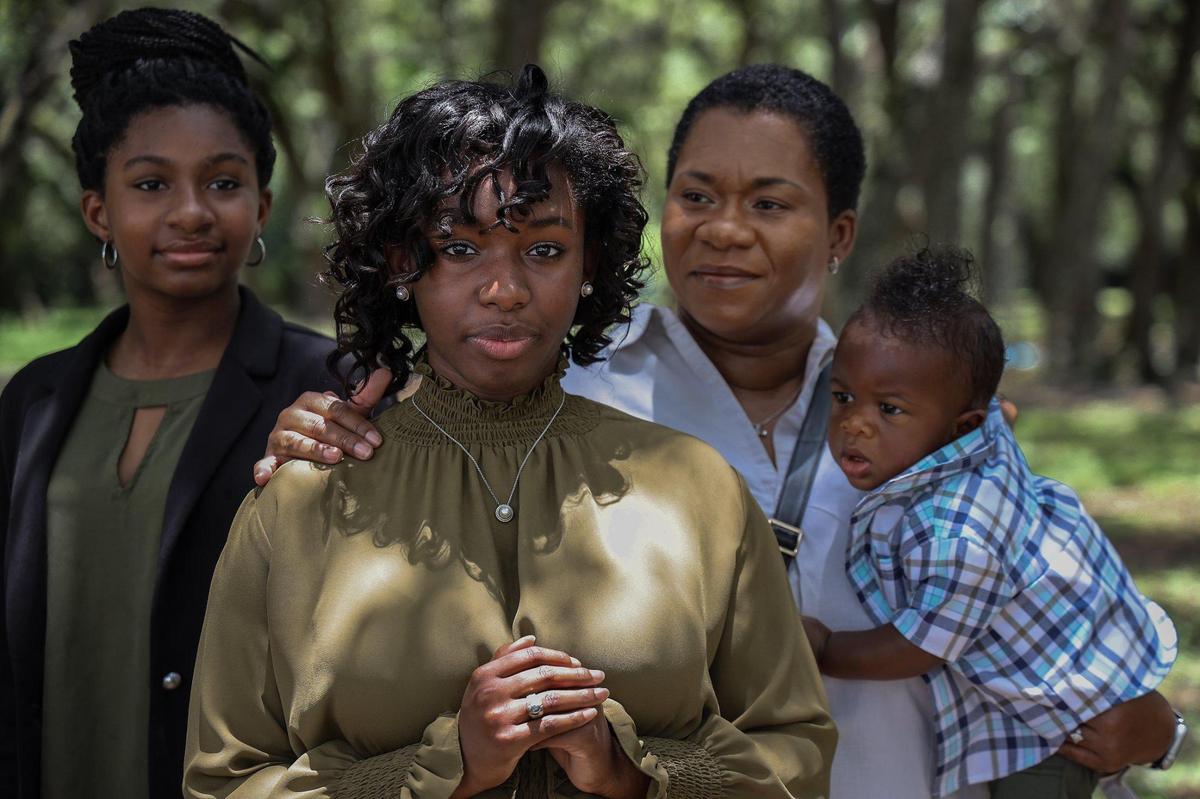 Heavyn Lee, 18, center, has graduated from Miami Beach High and is heading to Harvard University this fall on a four-year scholarship. She is also a Gates Scholar, a highly selective award given to only 300 high school seniors in the United States. Heavyn is photographed with sister Elicia, 13, mother Arnetria Lee, and baby brother Knight Lee, 8 months old, on Wednesday, July 8, 2020, at Rolling Oaks Park in Miami Gardens.