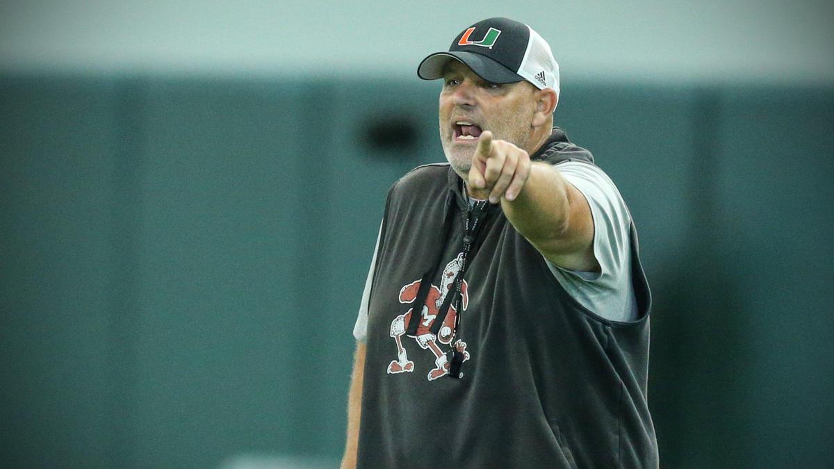 Miami Hurricanes Assistant Head Coach / Defensive Line Coach Jess Simpson, works with players during practice at the University of Miamis Carol Soffer Indoor Practice Facility in Coral Gables on Tuesday, August 10, 2021.