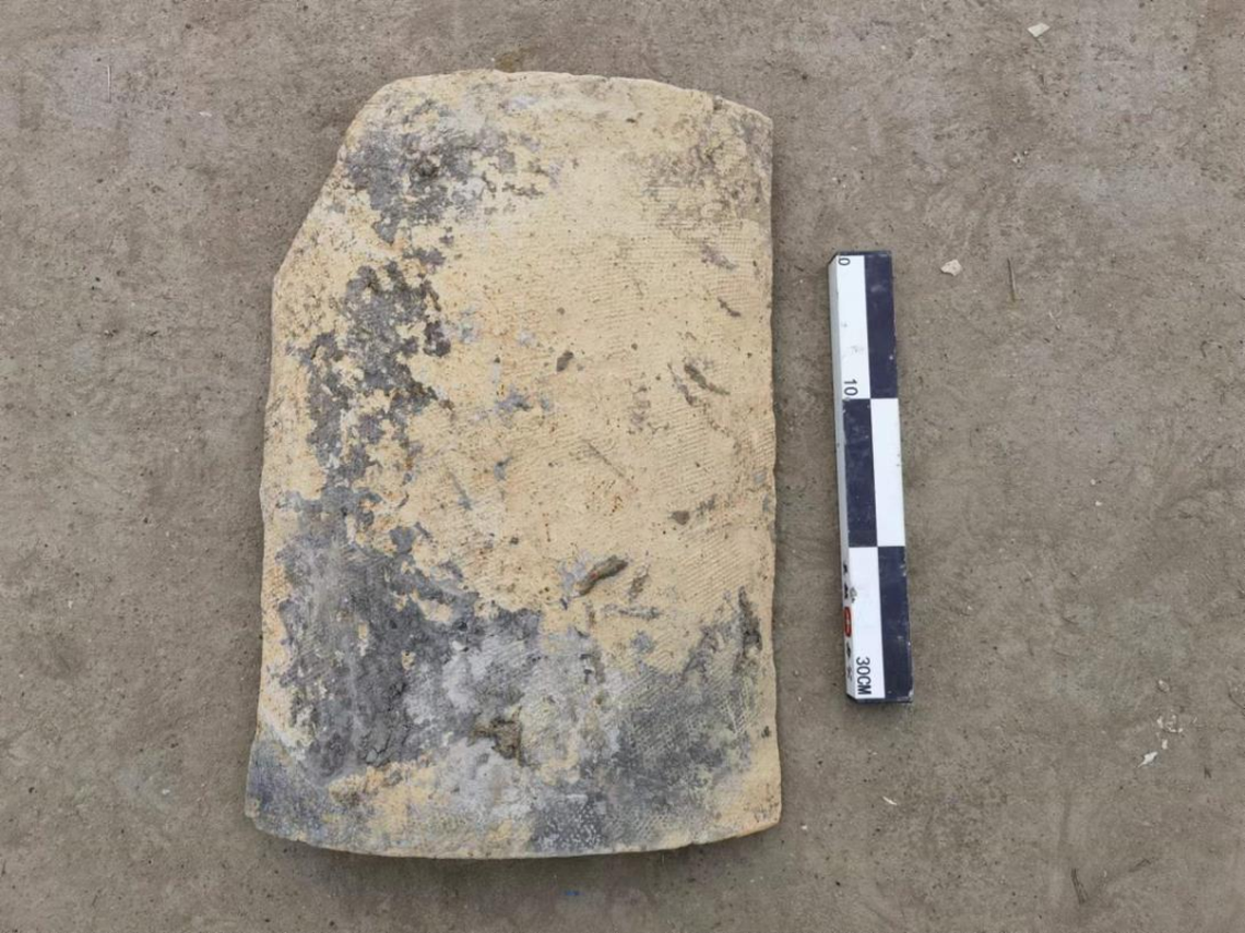 Large tiles were unearthed from the building ruins, experts said.