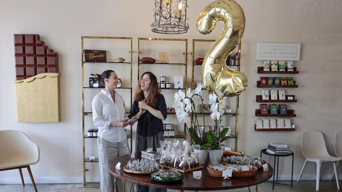 Sisters Susana Garcia Nevett, left, and Isabel Garcia Nevett, right, share their passion for chocolate inside their South Miami shop, Garcia Nevett Chocolatier de Miami. The fine chocolate shop, recently named one of the best in the country, was photographed on Thursday, June 26, 2026, in South Miami, Fla.