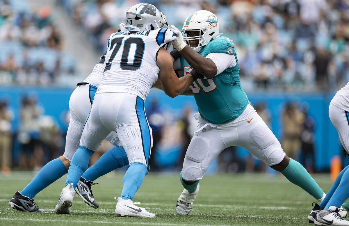 Miami Dolphins defensive tackle Kenneth Grant (90) defends against Carolina Panthers offensive tackle Brady Christensen (70) in the first half of their NFL game at the Bank of America Stadium on Sunday, Oct. 5, 2025, in Charlotte, N.C.