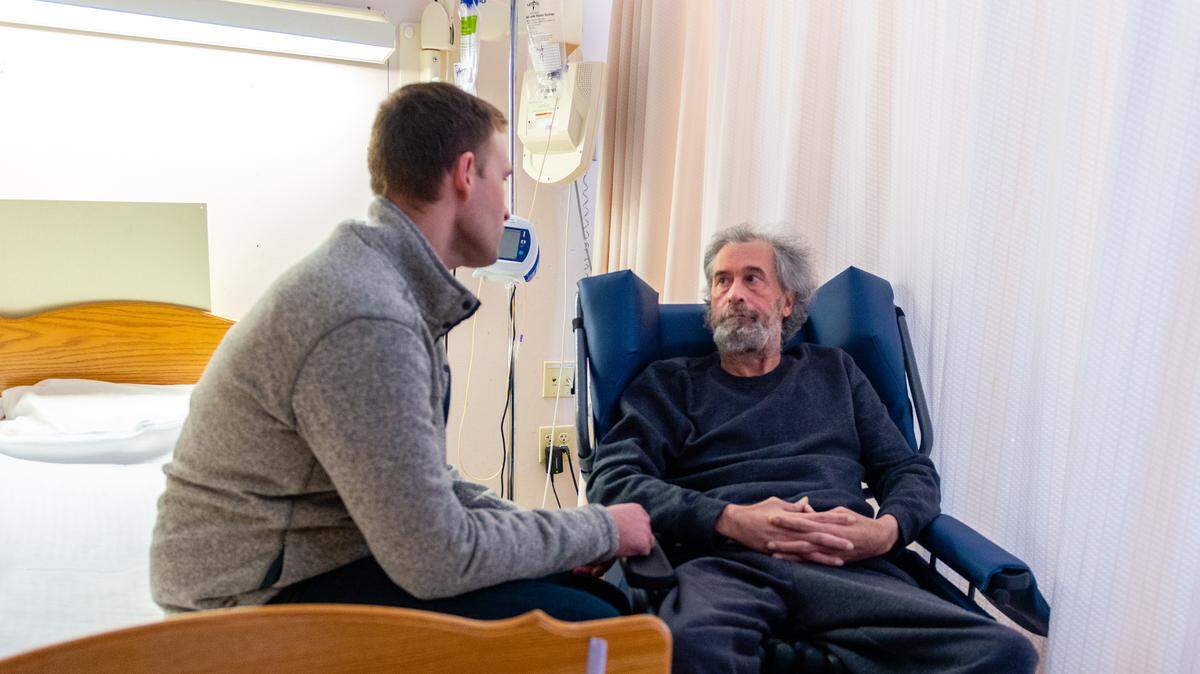 Phil Levering (left) says his father, Mark Levering, used to have a calm demeanor but now exhibits signs of aggression due to a brain injury he suffered after a surgery gone wrong.