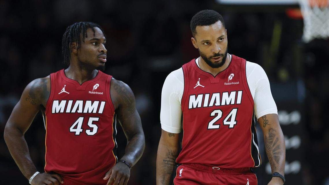 Miami Heat guard Davion Mitchell (45) and guard Norman Powell (24) walk together on the court in the first half against the Milwaukee Bucks during their NBA basketball game at Kaseya Center at Miami, FL, on Wednesday, November 26, 2025. 