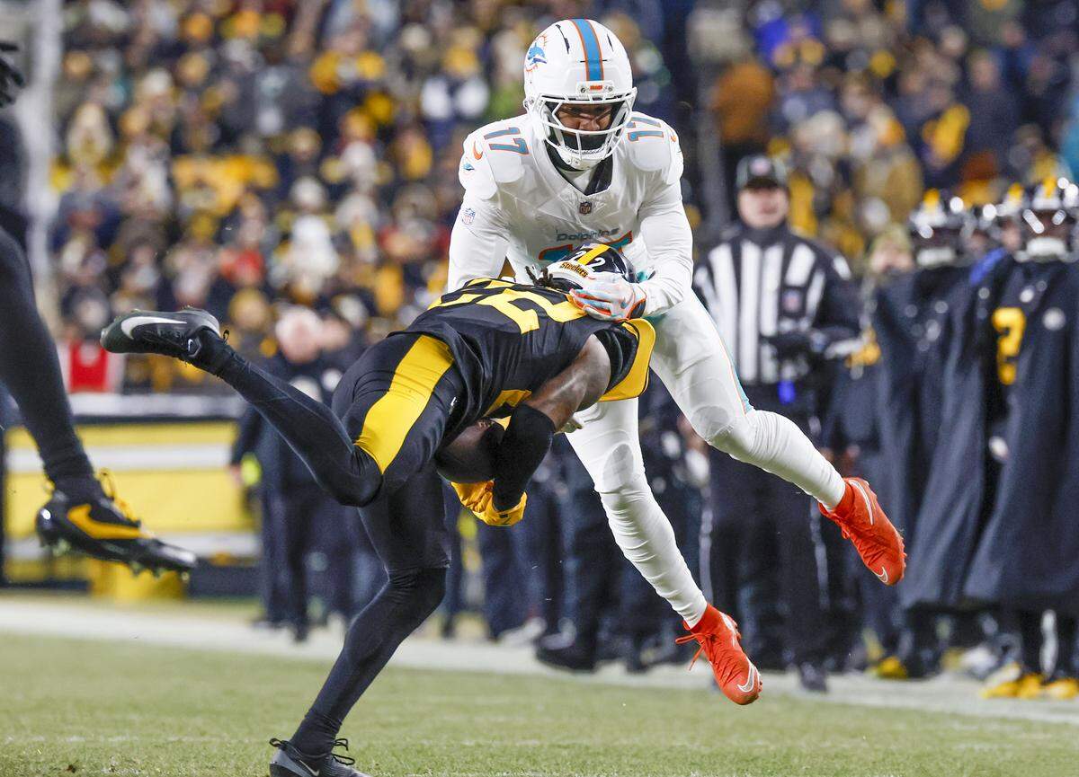 Pittsburgh Steelers cornerback Asante Samuel Jr. (22) intercepts the ball intended for Miami Dolphins wide receiver Jaylen Waddle (17) during the first half of their NFL football game at Acrisure Stadium in Pittsburgh, PA., on Monday, December 15, 2025.