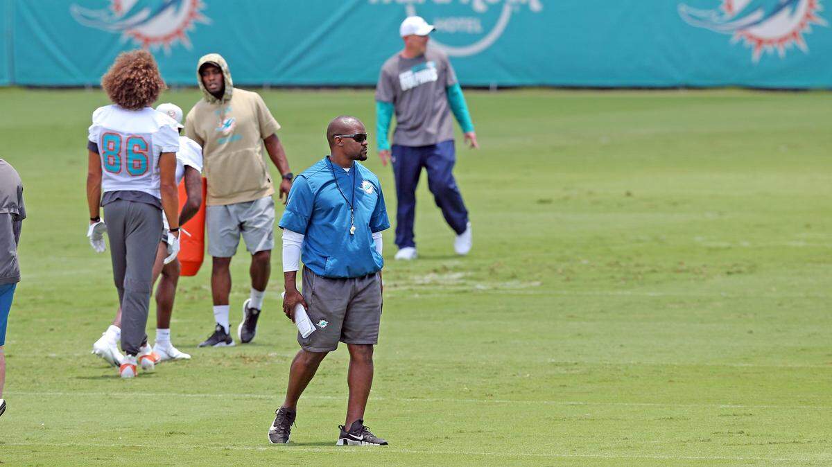 Miami Dolphins coach Brian Flores watches players run drills during OTAs, Organized Team Activities, at the Baptist Health Training Facility in Davie on Wednesday, May 26, 2021.