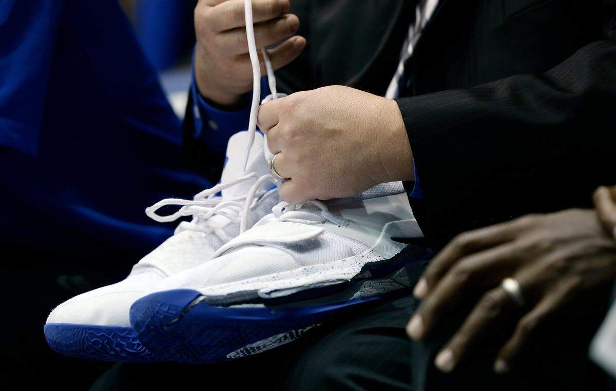 A trainer holds Duke’s Zion Williamson’s shoes after Williamson left the game due to an injury during the first half of an NCAA college basketball game against North Carolina in Durham, N.C., Wednesday, Feb. 20, 2019. Duke might have to figure out what the Zion Show will look like without its namesake. All because of a freak injury to arguably the most exciting player in college basketball. As his Nike shoe blew out, Williamson sprained his right knee on the first possession of what became top-ranked Duke’s 88-72 loss to No. 8 North Carolina.