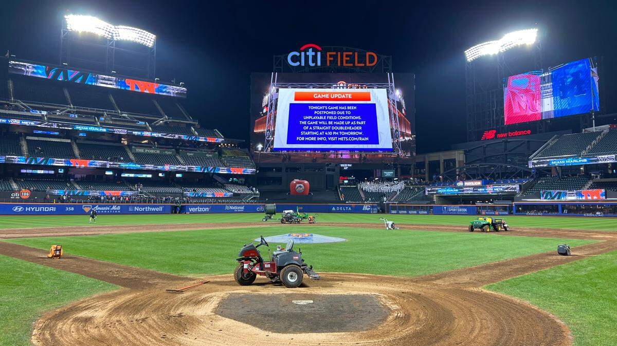 Sep 26, 2023; New York City, New York, USA; An announcement on the scoreboard at Citi Field after a game between the New York Mets and Miami Marlins was postponed due to unplayable field conditions. The game will be made up as part of a straight doubleheader Wednesday.