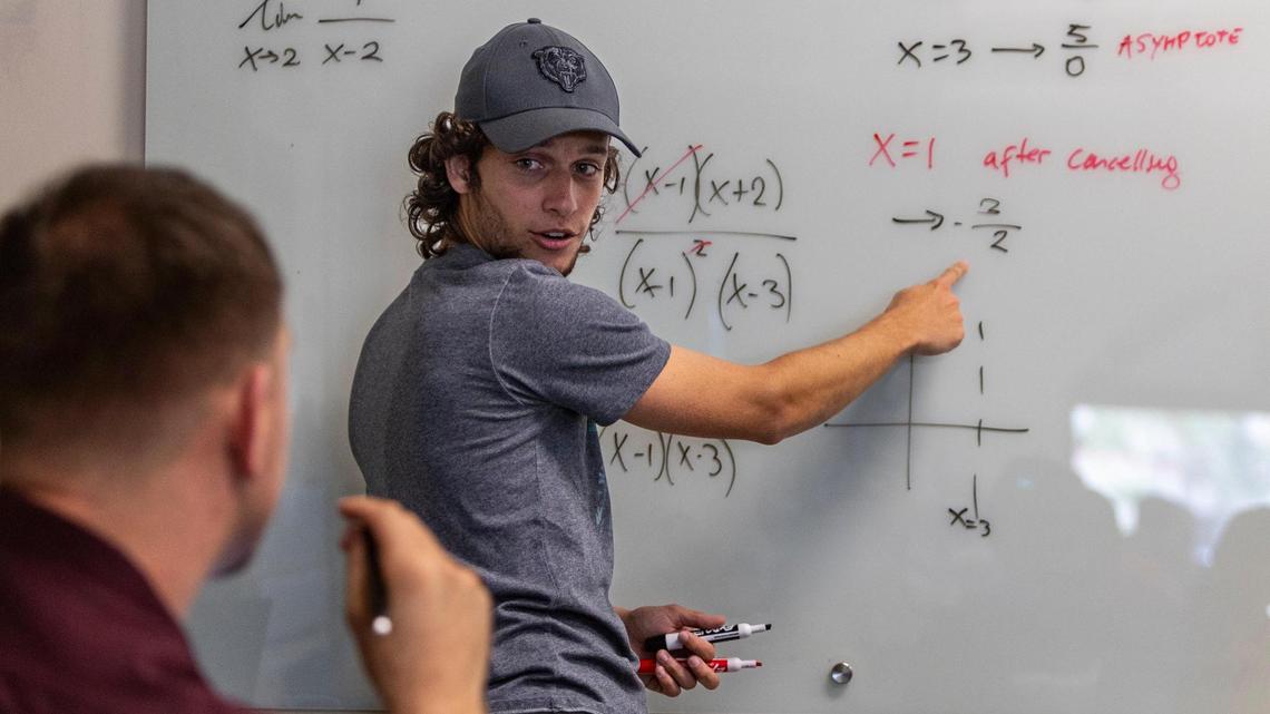 Learning Assistant Juan Ignacio Sanchez Quintana, center, works with a student in Calculus I class. FIU changed the way it teaches calculus, and managed to increase the pass rate. Miami, Florida, August 31, 2023 -