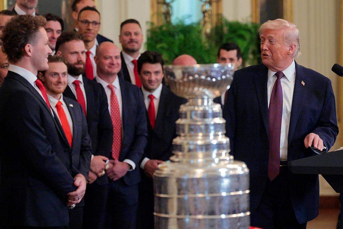 WASHINGTON, DC - JANUARY 15: Matthew Tkachuk of the Florida Panthers (L) looks on as U.S. President Donald Trump (R) speaks during a ceremony to honor the 2025 Stanley Cup Champion Florida Panthers in the East Room of the White House on January 15, 2026 in Washington, DC. The Florida Panthers defeated the Edmonton Oilers for the second straight year in their first-ever championships since joining the NHL in 1993. (Photo by Chip Somodevilla/Getty Images)