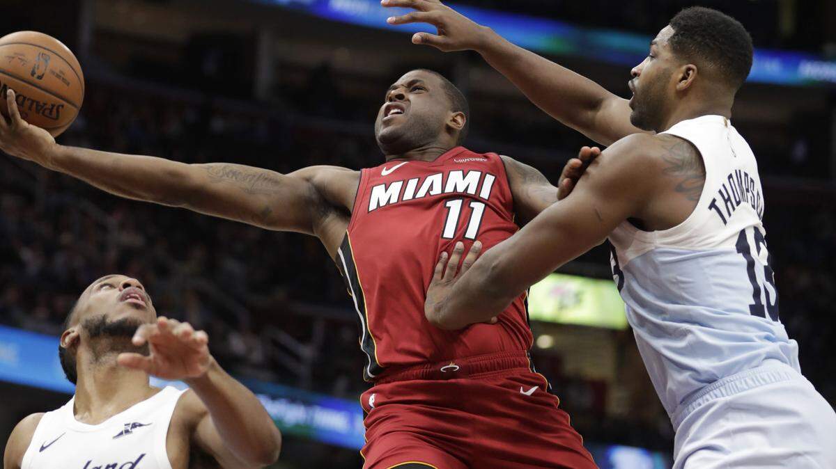 Miami Heat’s Dion Waiters (11) drives to the basket against Cleveland Cavaliers’ Tristan Thompson (13) in the second half of an NBA basketball game, Wednesday, Jan. 2, 2019, in Cleveland. (AP Photo/Tony Dejak)