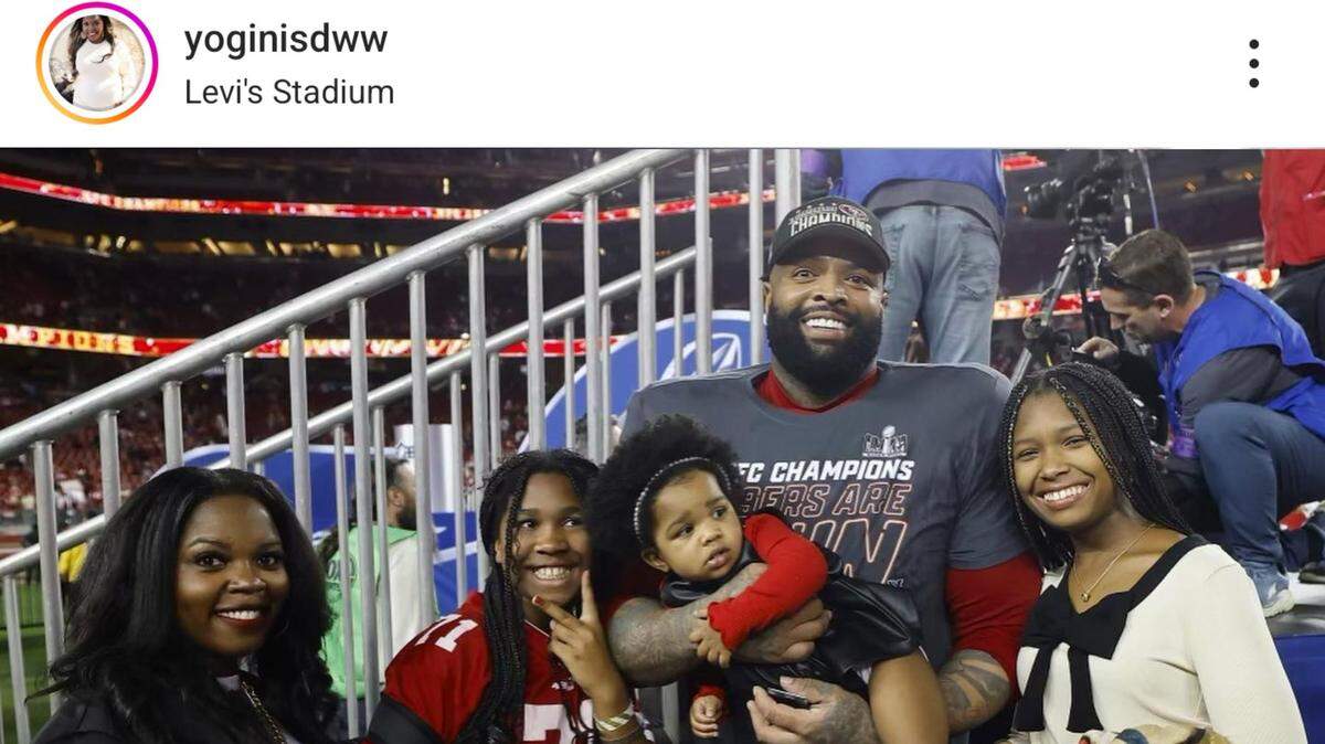 Trent Williams and his wife, Sondra Williams, pose with their three daughters at the NFC Championship Game.