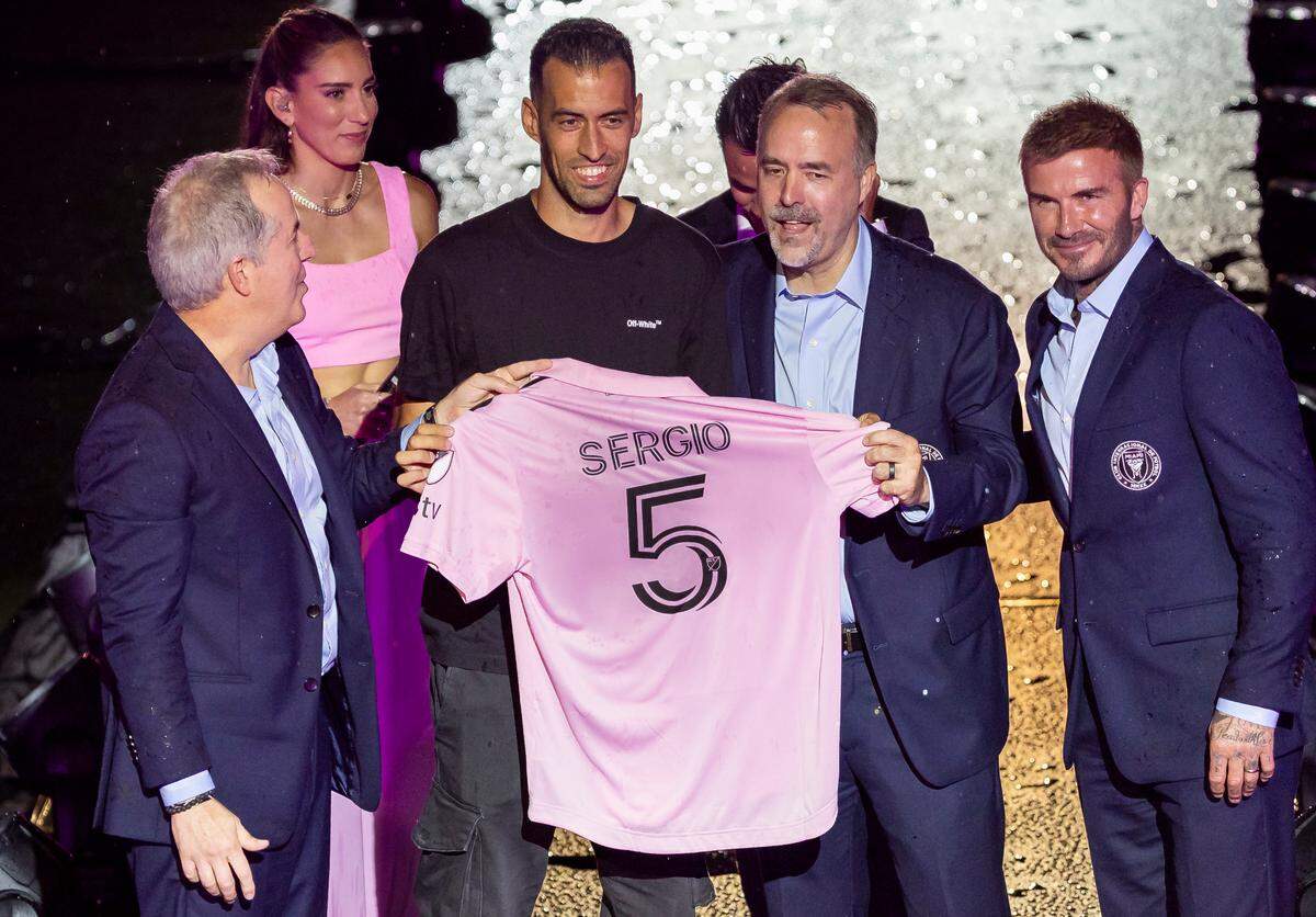 Sergio Busquets presents his jersey next to Inter Miami owners, Jorge Mas, far-left, Jose Mas, third from left, and David Beckham, far-right, during the team’s The Unveil event at DRV PNK Stadium on Sunday, July 16, 2023, in Fort Lauderdale, Fla. The event was held to officially welcome Argentine forward Lionel Messi (10) and Spanish midfielder Sergio Busquets (5) to the team.