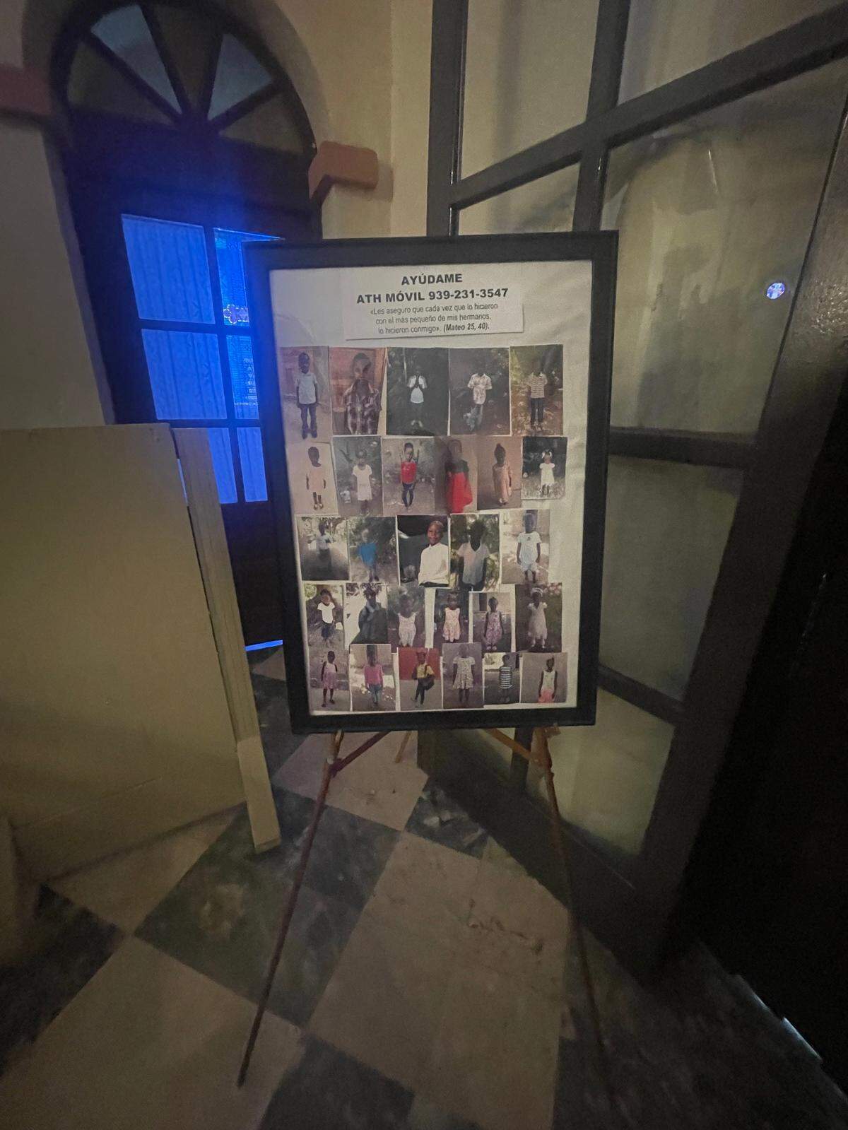 A sign by the door at the San Mateo de Cangrejos Church asks congregants to donate money for Haitians.