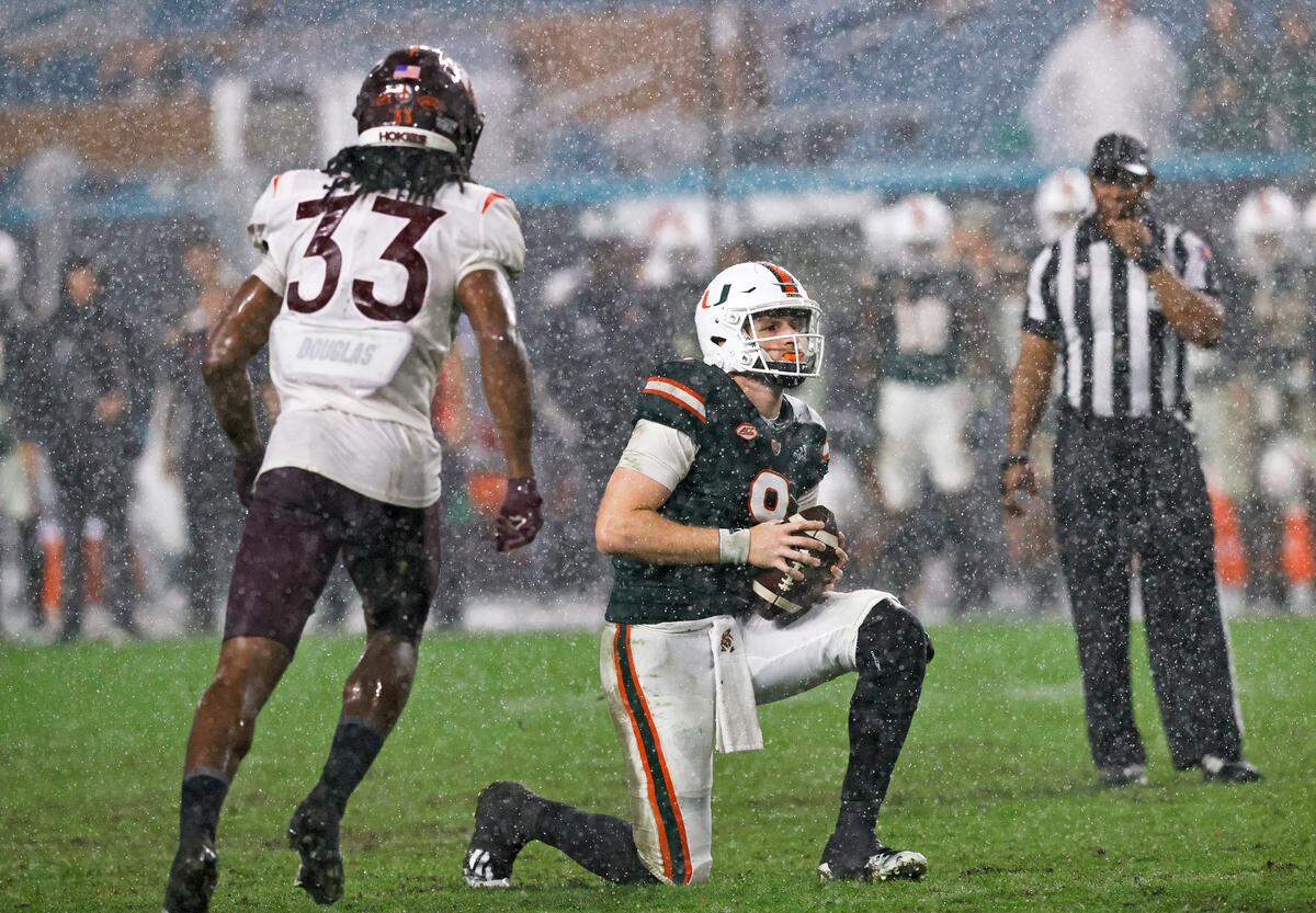 Miami Hurricanes quarterback Tyler Van Dyke (9) takes a knee during the fourth quarter of their ACC football game against the Virginia Tech Hockies at Hard Rock Stadium on Saturday, November 20, 2021 in Miami Gardens, Florida.