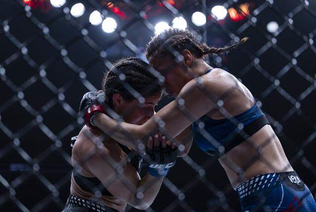 Tatiana Suarez of the United States and Loopy Godinez of Mexico fight in their strawweight bout at UFC 327 at the Kaseya Center on Saturday, April 11, 2026, in downtown Miami, Fla.