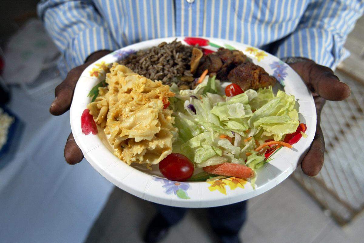 11/16/03-C.W. GRIFFIN/HERALD STAFF--MIAMI- This plate contains some tipically Haitian dishes, especially the Griot, Haitian Macaroone and Djon Djon (rice dish) and salad.