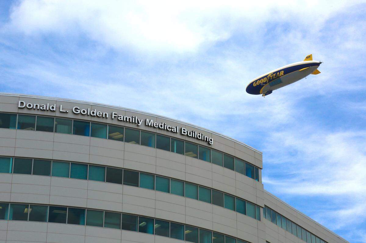 In this file photo, The Goodyear Blimp flies over Mount Sinai Medical Center in Miami Beach to honor frontline workers and essential personnel serving the South Florida communities on Friday, May 22, 2020. 