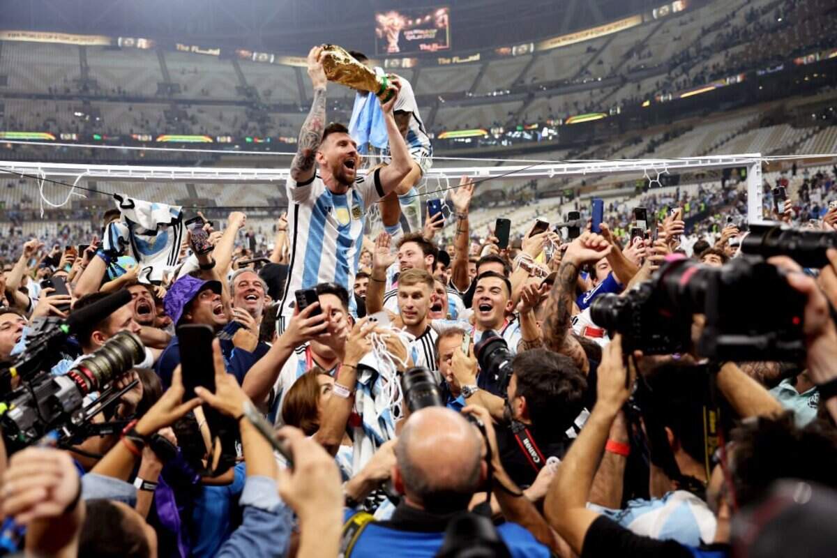 Lionel Messi of Argentina celebrates with teammates after winning the 2022 FIFA World Cup after the team’s championship-match victory over France on Dec. 18, 2022 in Lusail City, Qatar.