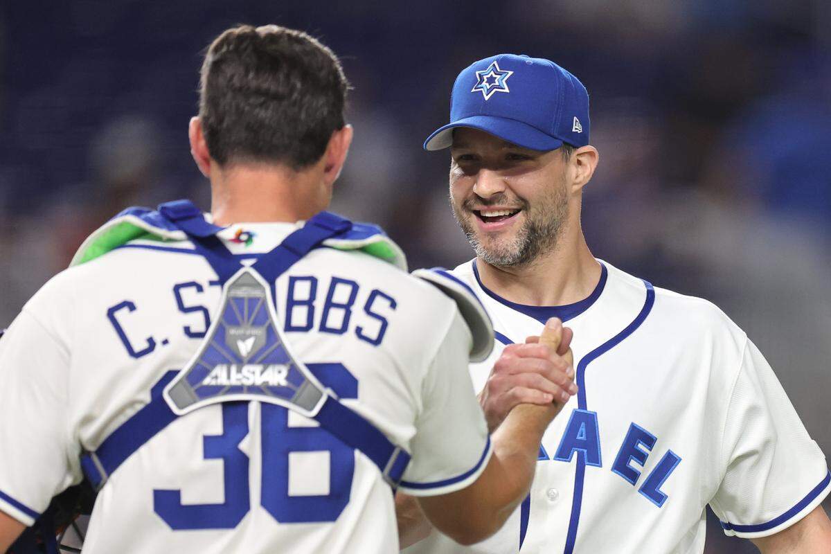 Tommy Kahnle #43 celebrates with C.J. Stubbs #36 of the Israel after defeating Nicaragua 5-0 at loanDepot park on March 08, 2026 in Miami, Florida.