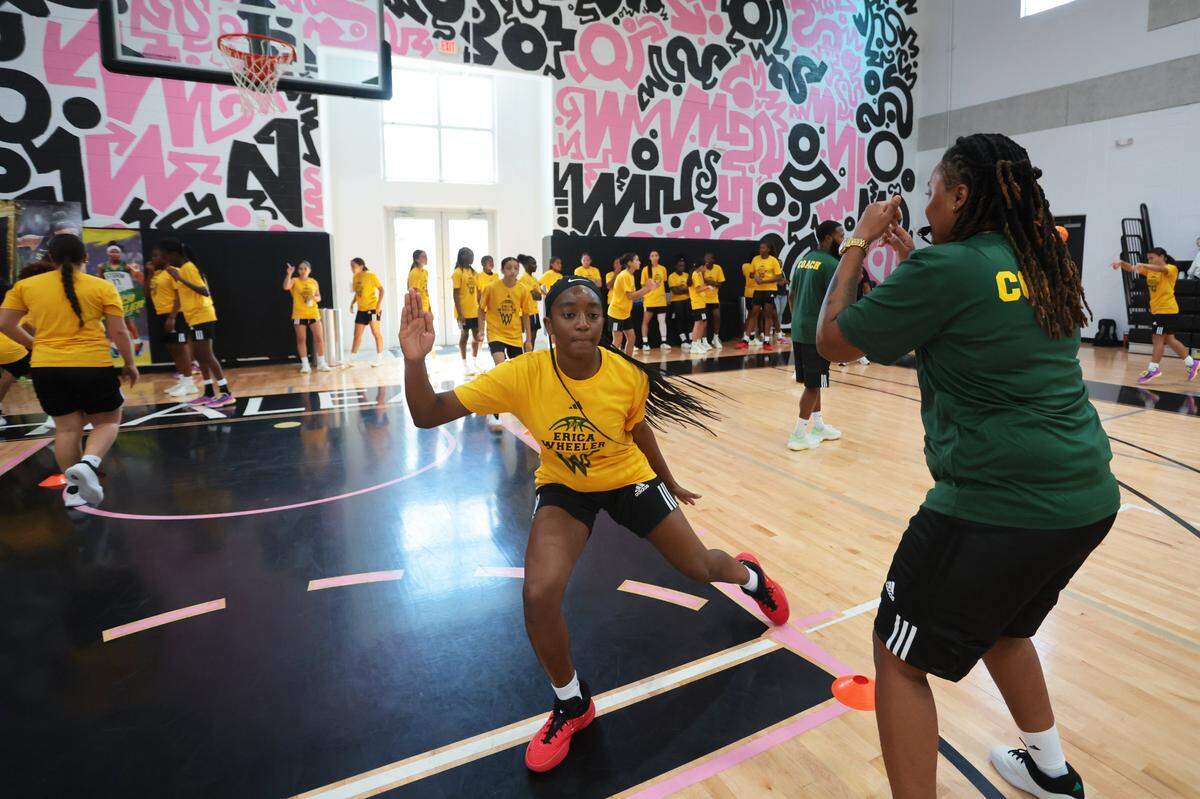 A camper at the Erica Wheeler Basketball Camp participates in a defensive exercise at Bucky Dent Park at 2240 W 60th St., in Hialeah, Florida, Saturday, October 18, 2025.