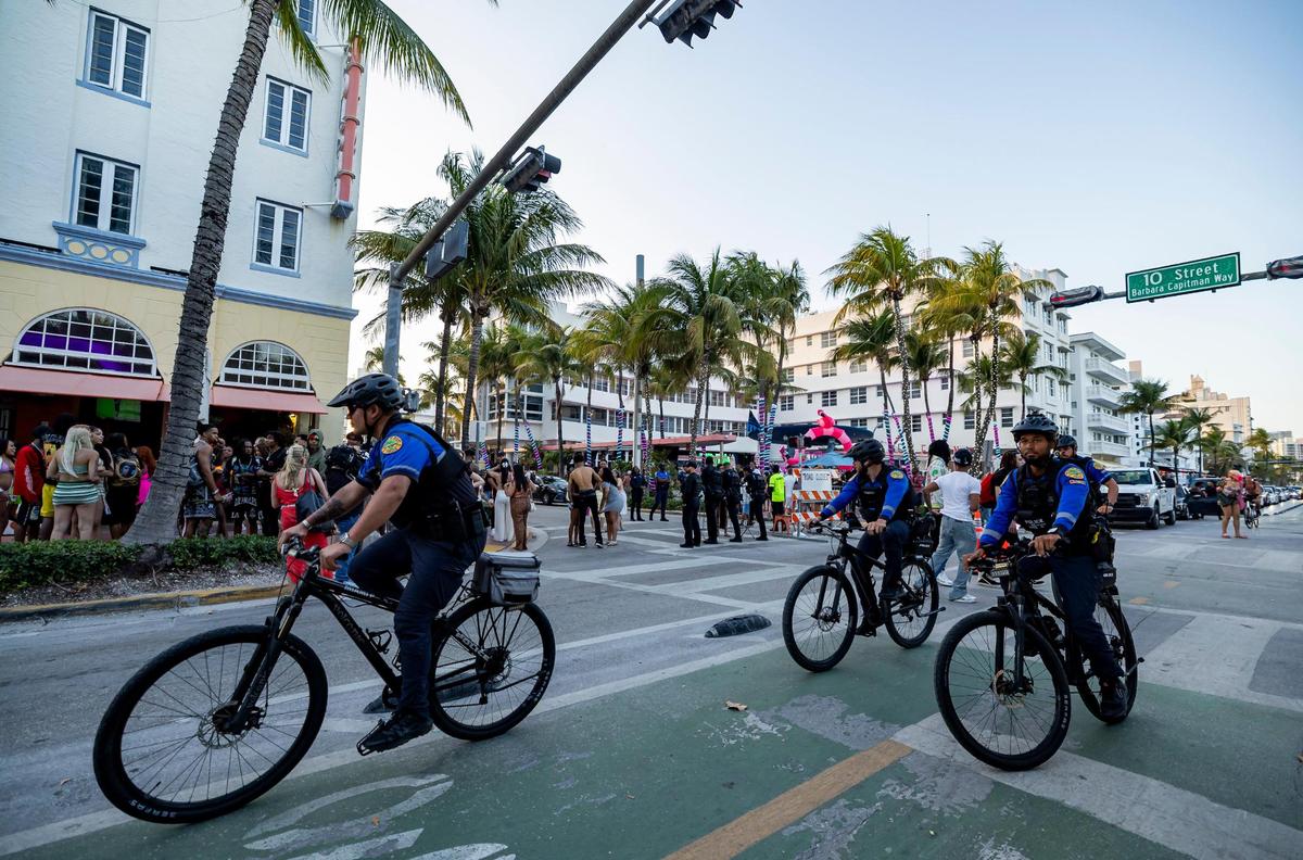 City of Miami police officers patrol down Ocean Drive near 10th Street during spring break on Saturday, March 15, 2025, in Miami Beach, Fla.