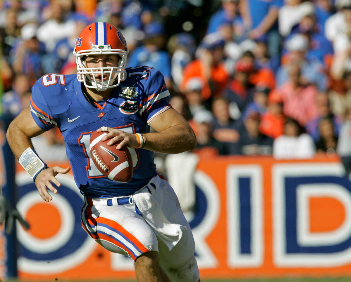 FILE - In this Nov. 17, 2007, file photo, Florida quarterback Tim Tebow scrambles from the backfield during the second half of a football game against Florida Atlantic in Gainesville, Fla. Tebow was announced as a first-time candidate for College Football’s Hall of Fame on Monday, June 6, 2022.