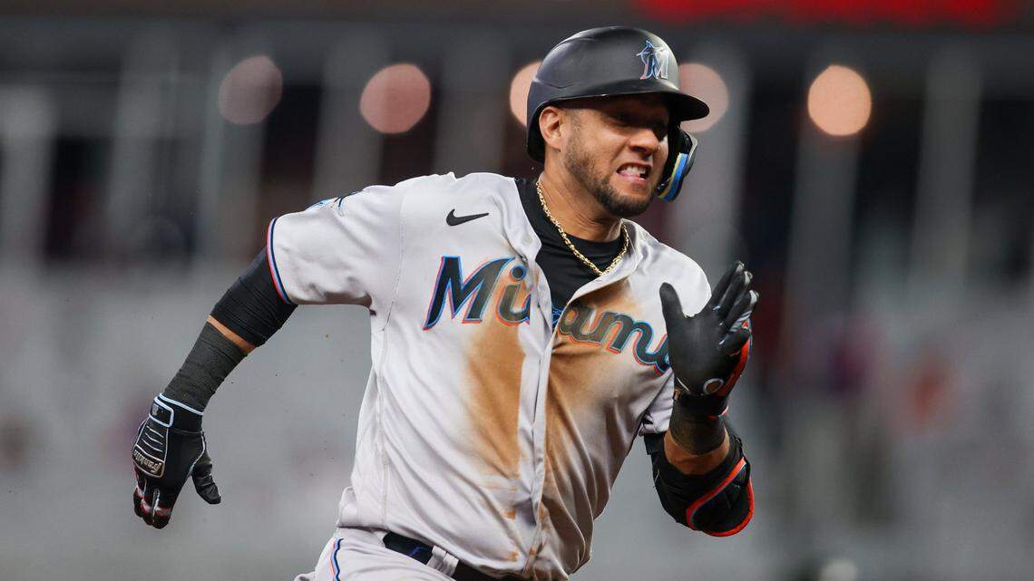 Miami Marlins first baseman Yuli Gurriel (10) hits an inside the park home run against the Atlanta Braves in ninth inning at Truist Park on Tuesday, April 25, 2023.