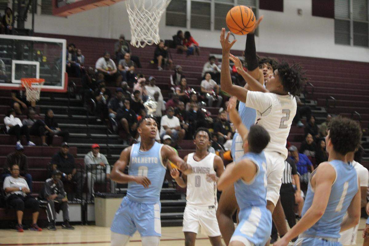 Miami Norland’s Triston Wilson drives to the basket during the Vikings’ 64-59 overtime loss to Palmetto at home on Wednesday night in the GMAC tournament semifinals.