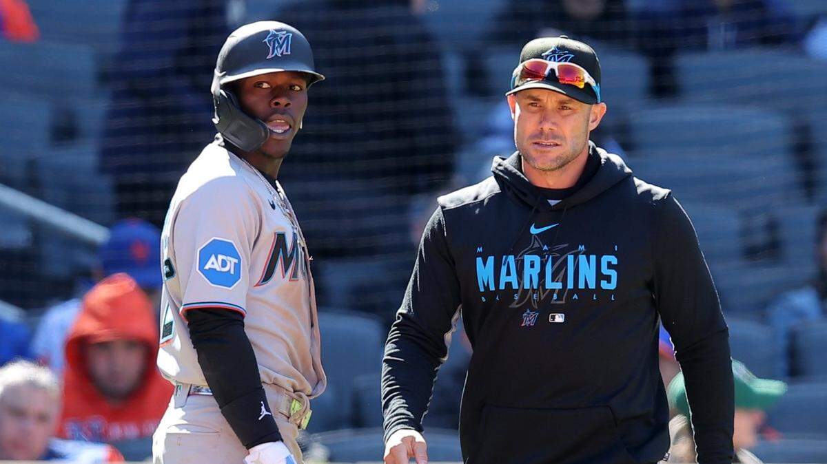 Miami Marlins center fielder Jazz Chisholm Jr. (2) and manager Skip Schumaker (55) talk to home plate umpire Jeff Nelson (not pictured) after Nelson ejected Chisholm for arguing a called third strike during the seventh inning against the New York Mets at Citi Field on Sunday, April 9, 2023.