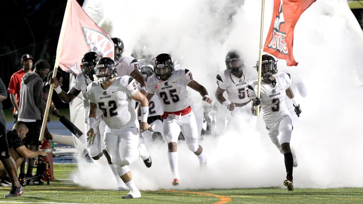 Miami Southridge players run out to the field during the opening of the Miami Southridge High School vs Miami Palmetto Varsity high school football game at Tropical Park on Friday, September 28th, 2018.